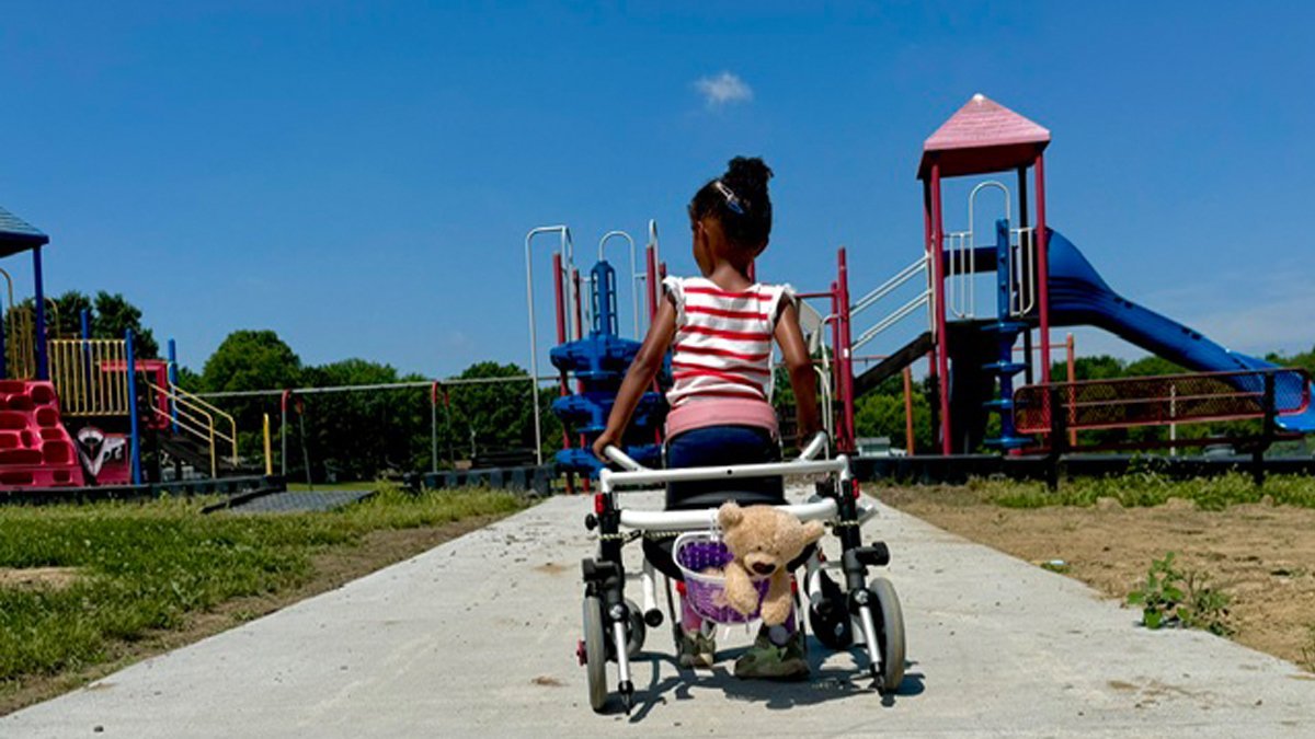 Child Uses Accessible Walkway to Access Playground